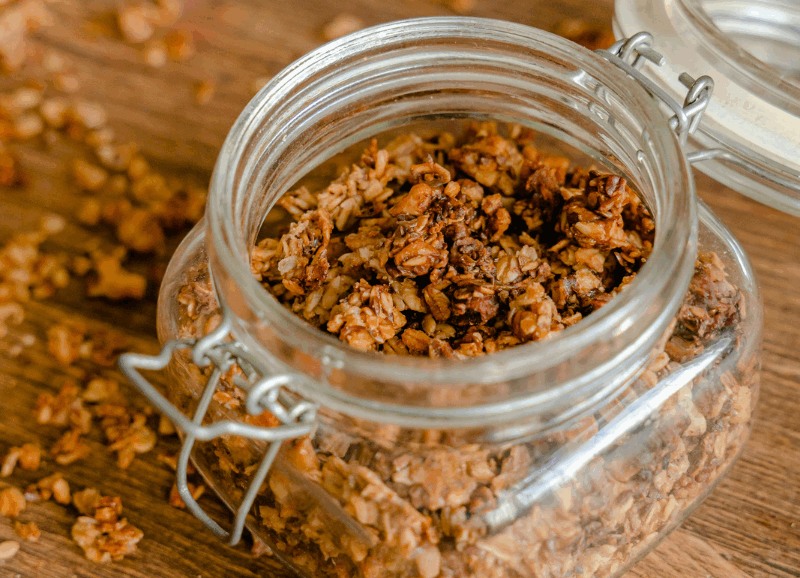Homemade superfood quinoa granola with oats, chia seeds, almonds, pumpkin seeds, and coconut shavings